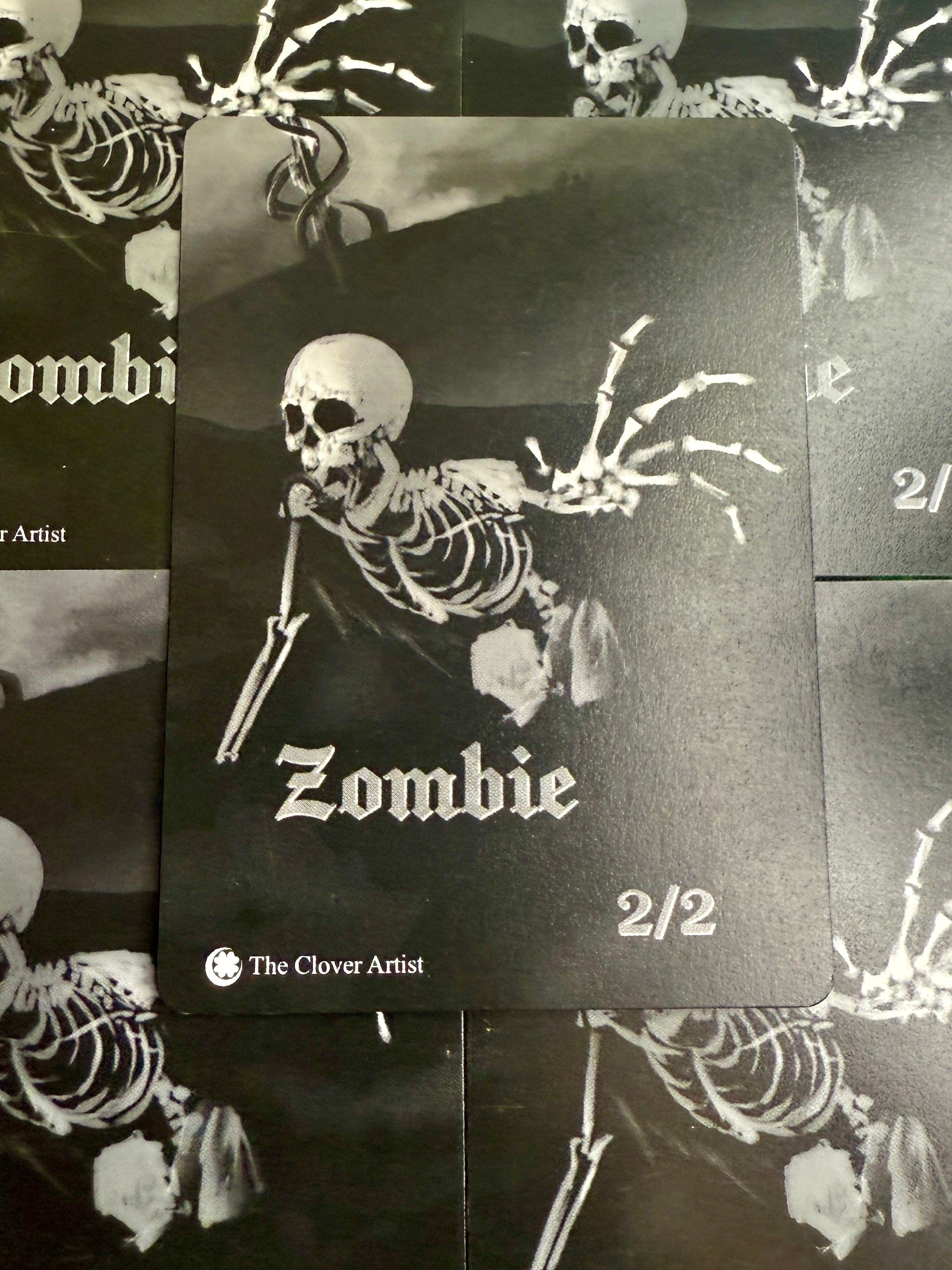 Skeletal design on a black card with 'Zombie' text, surrounded by skeleton-themed elements.