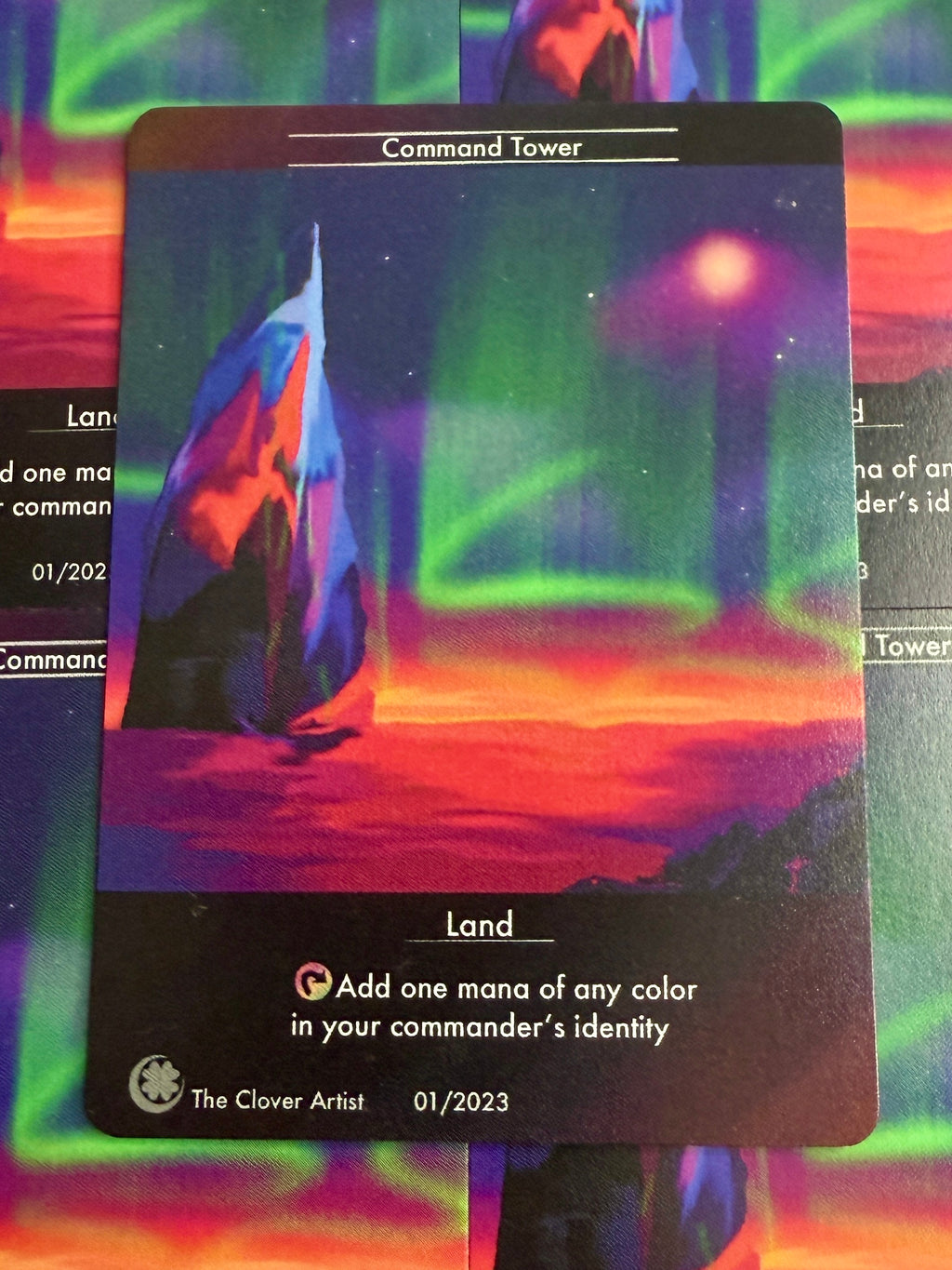 Card with a colorful landscape and text on a multicolored background