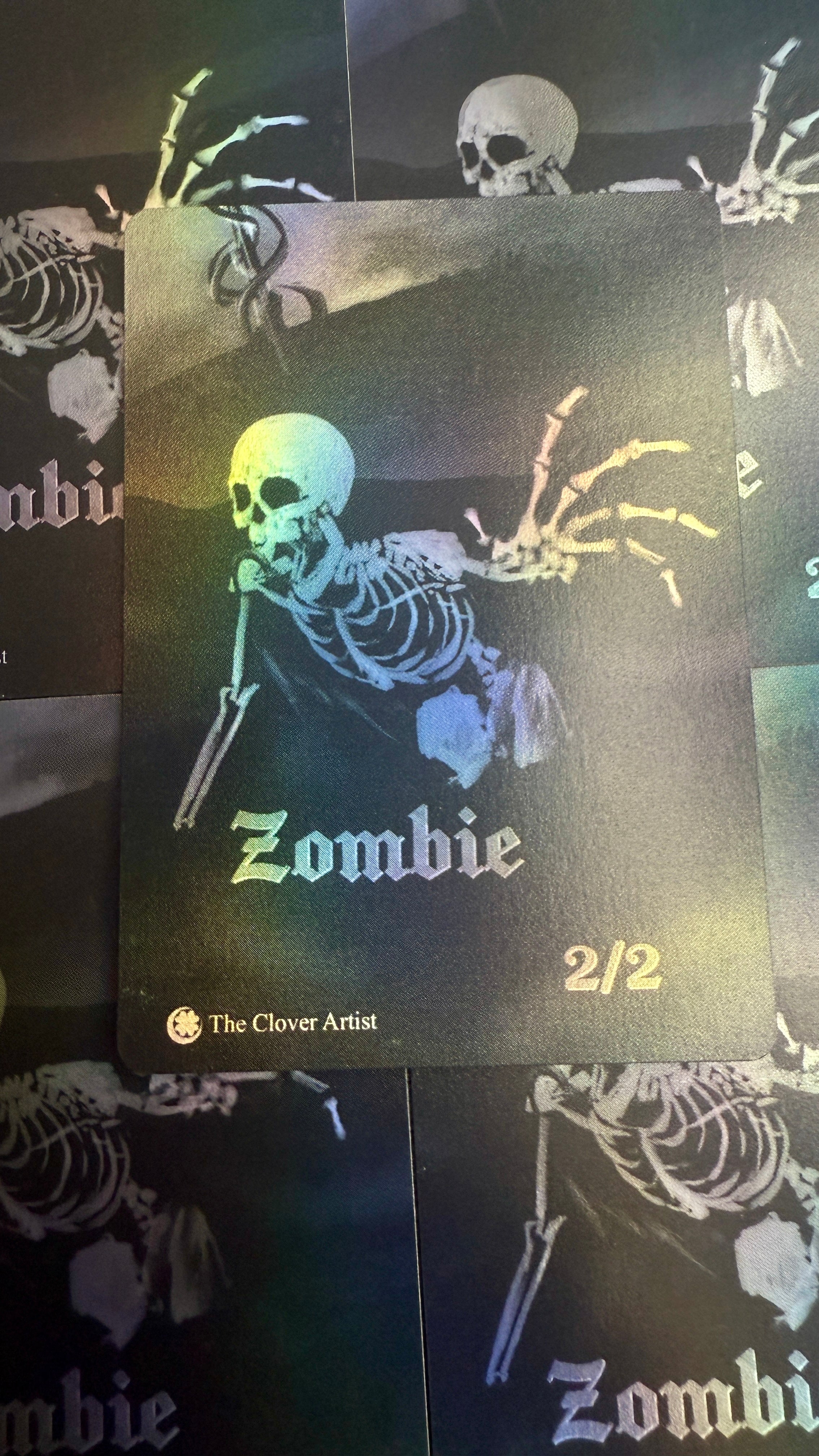 Zombie-themed product with skeleton design and 'The Clover Artist' branding on a dark background.