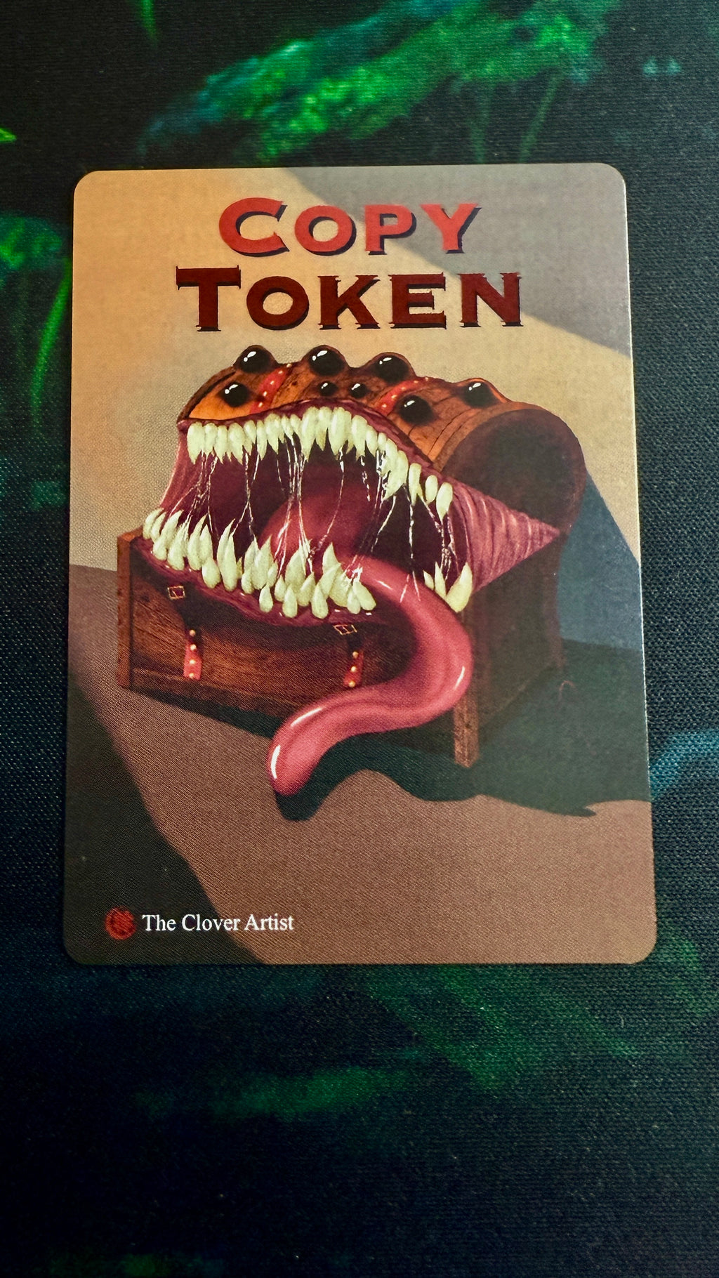 Card with a creature illustration labeled 'Copy Token' on a dark background