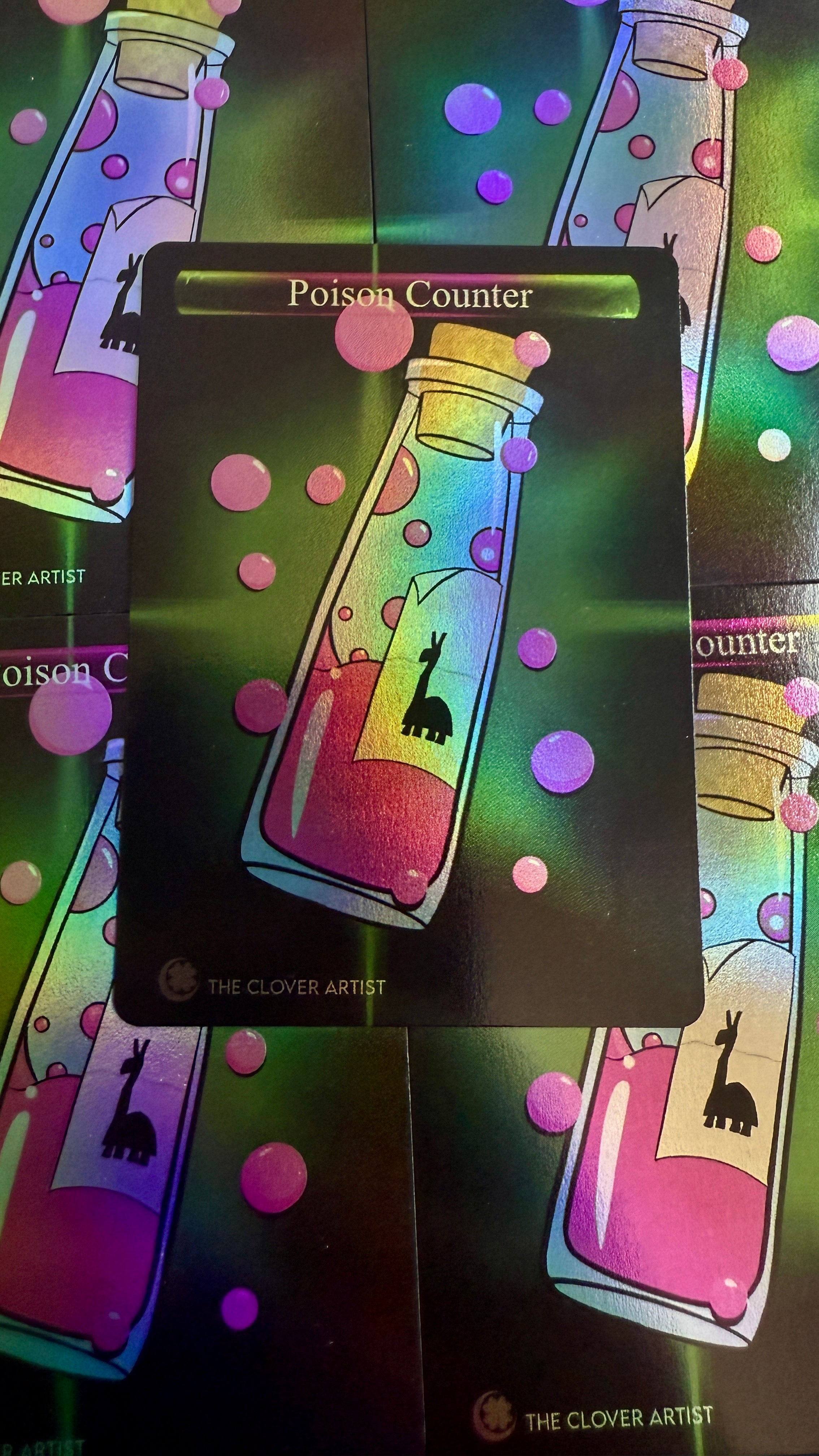Card with a colorful bottle illustration and text 'Poison Counter' on a dark background.