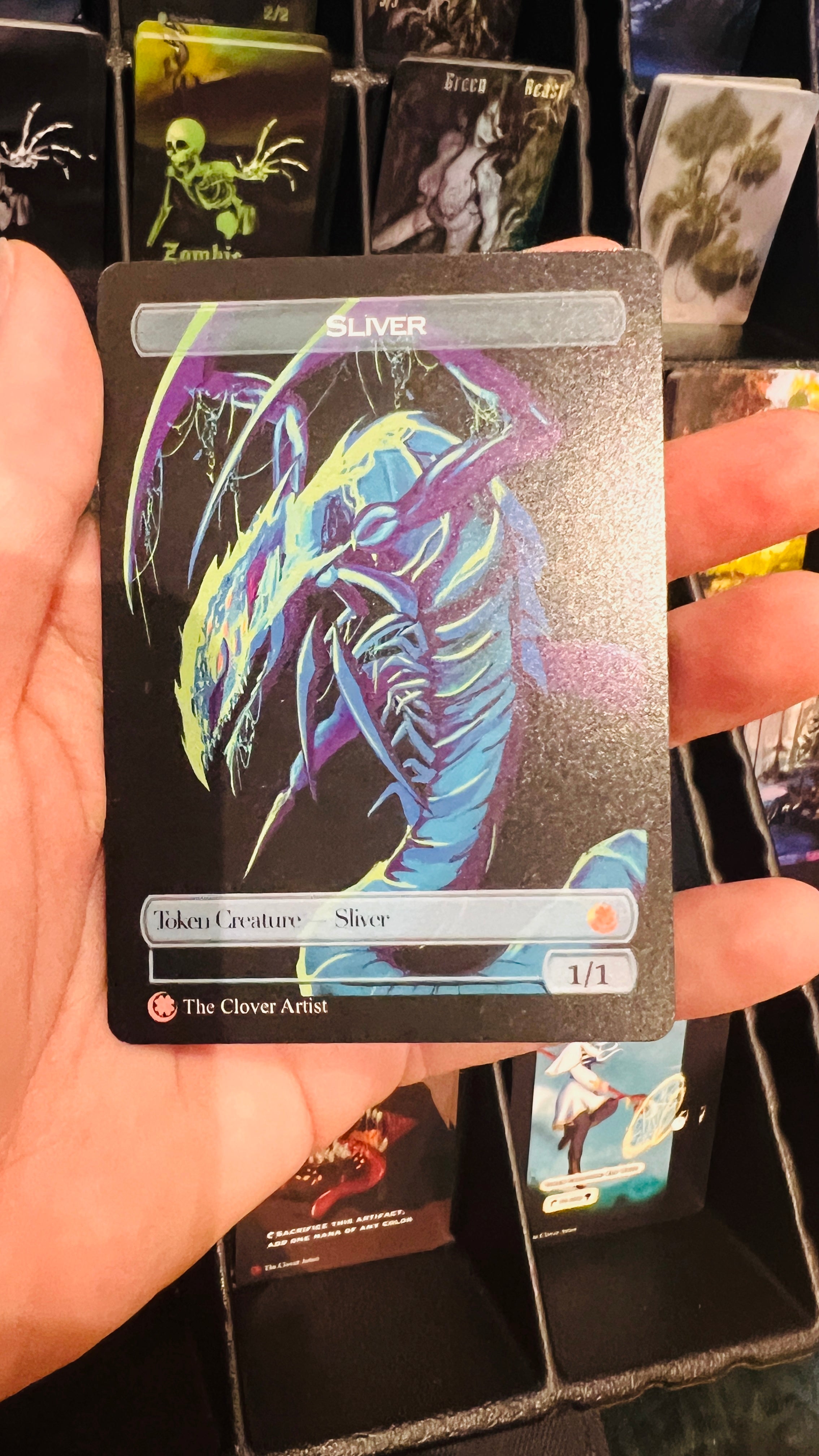 hand holding a non foil sliver token mtg