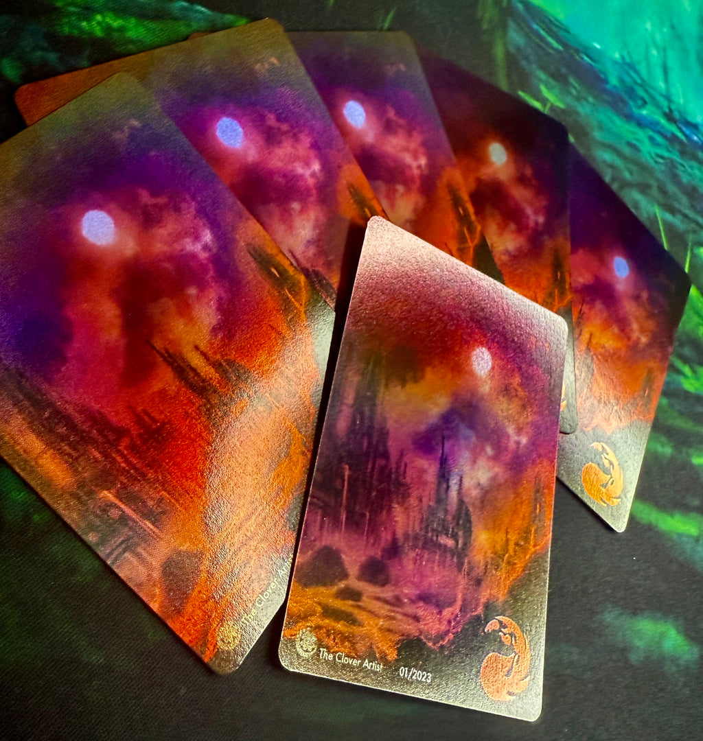 Set of mtg cards with fantasy-themed artwork on a dark surface
